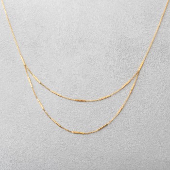 Collier femme double rang grunge en or 18 carats.