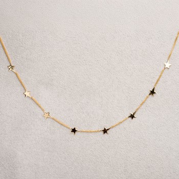 Collier femme étoiles asymétrique en or 9 carats.