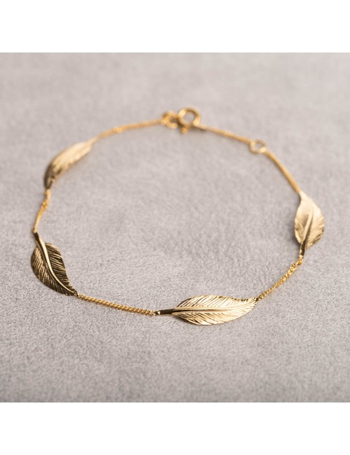 Bracelet femme quatre grosse plumes en or 9 carats.