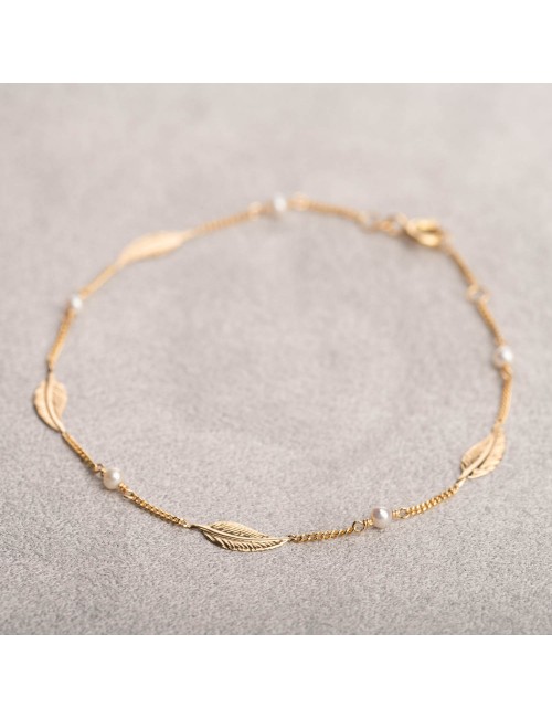 Bracelet femme plume et perle d'eau douce en or 18 carats.