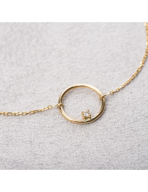 Bracelet femme fil rond sertie d'un diamant 0,03 carats en or 18 carats.