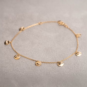 Bracelet femme orné de sept ronds froissés en breloque en or 18 carats.